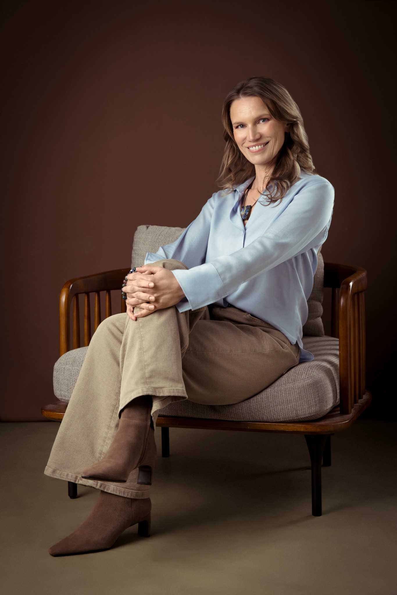 Erie seated against a warm brown background